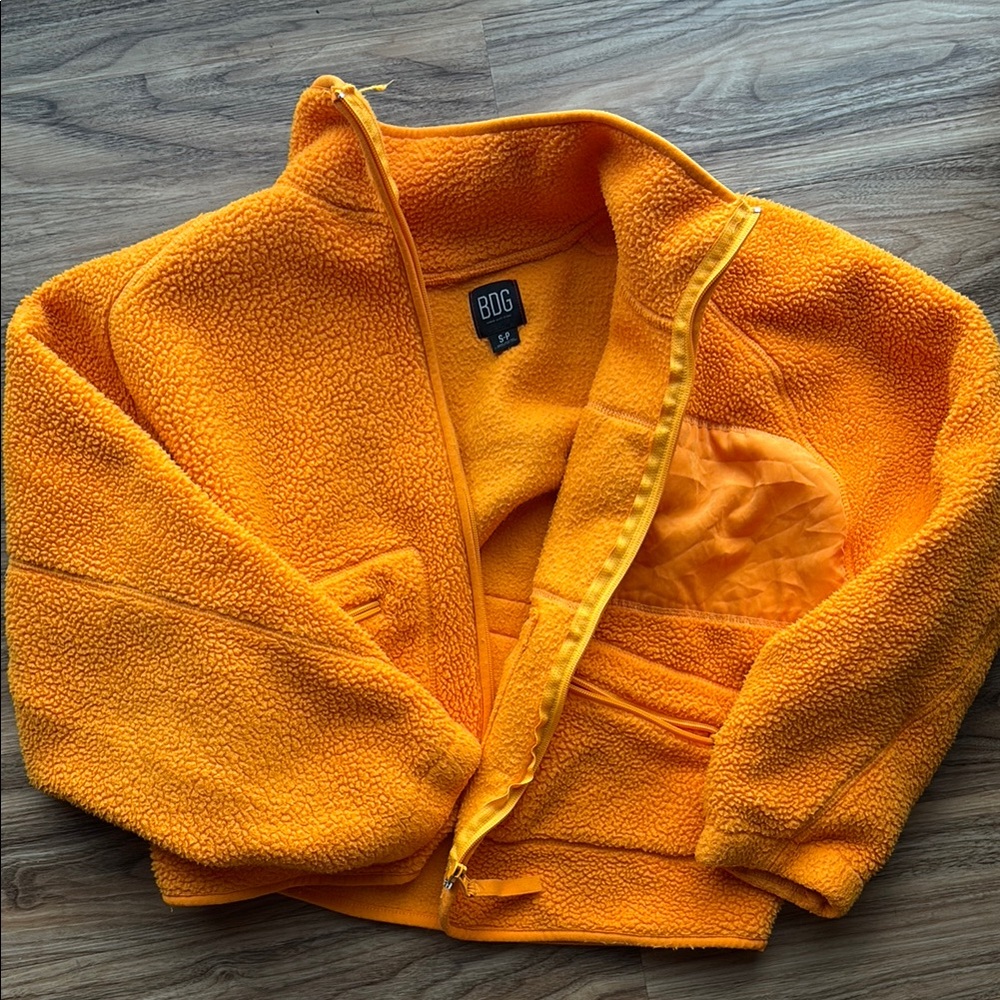 Urban Outfitters orange fleece zip up jacket